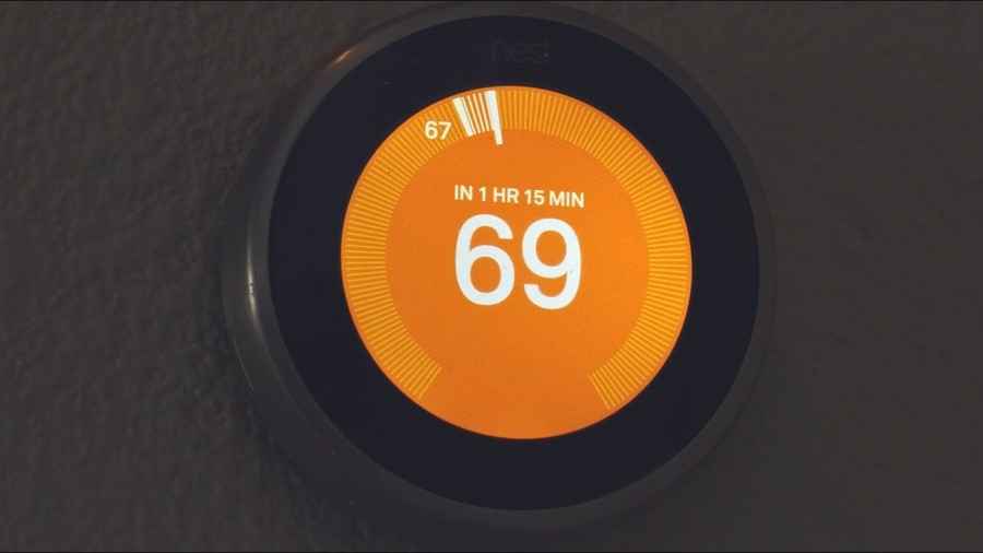 Nest thermostat showing a temperature of 69 degrees Fahrenheit.