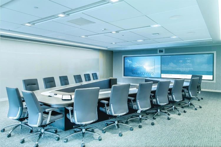 Crestron control in an executive conference room with large video wall and video conferencing technology