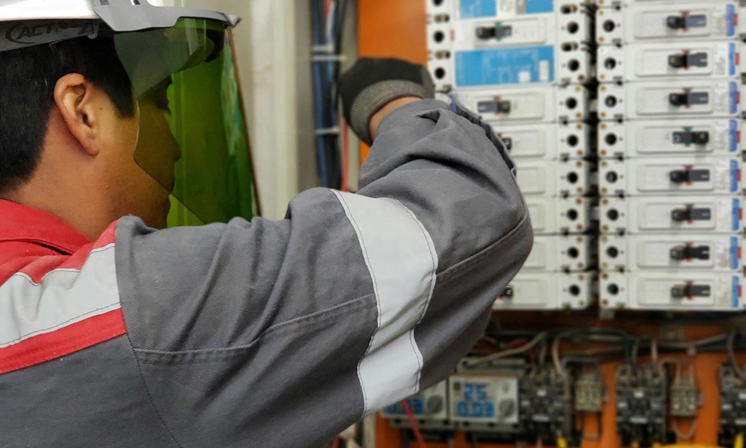 Man working on an electrical panel